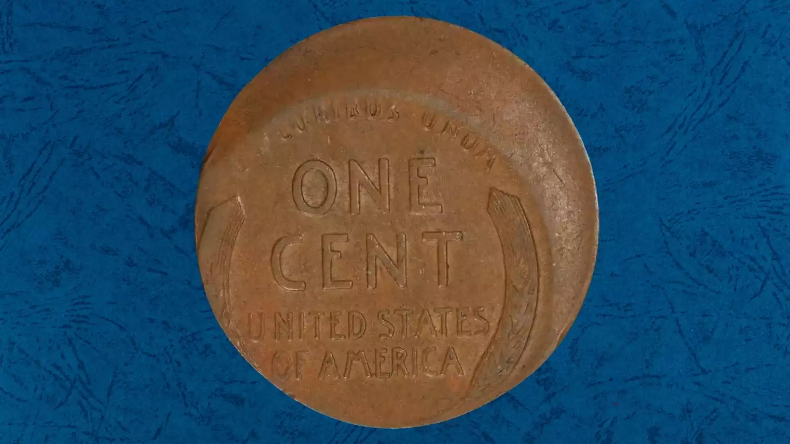 1930 wheat penny off-center strike error showing design shifted from center with blank planchet crescent